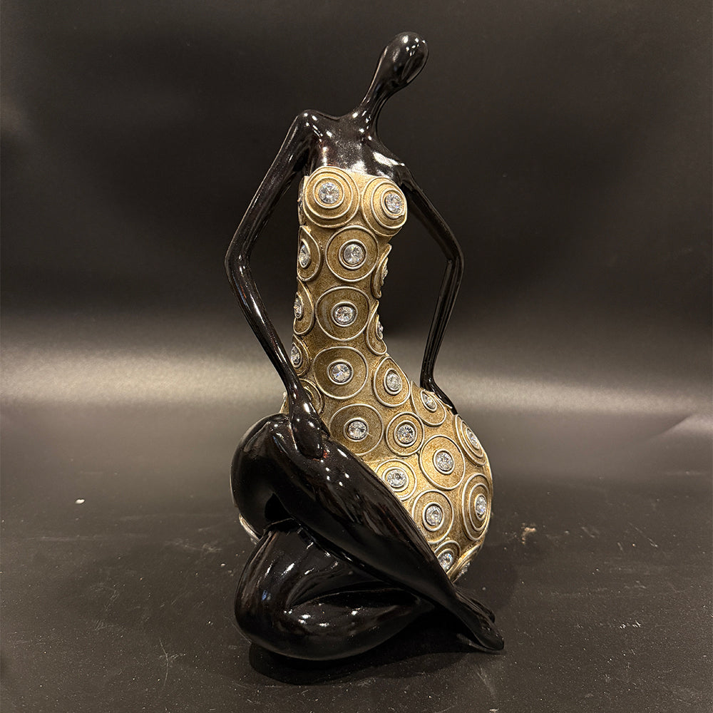 Modern Figurine Of seated Woman